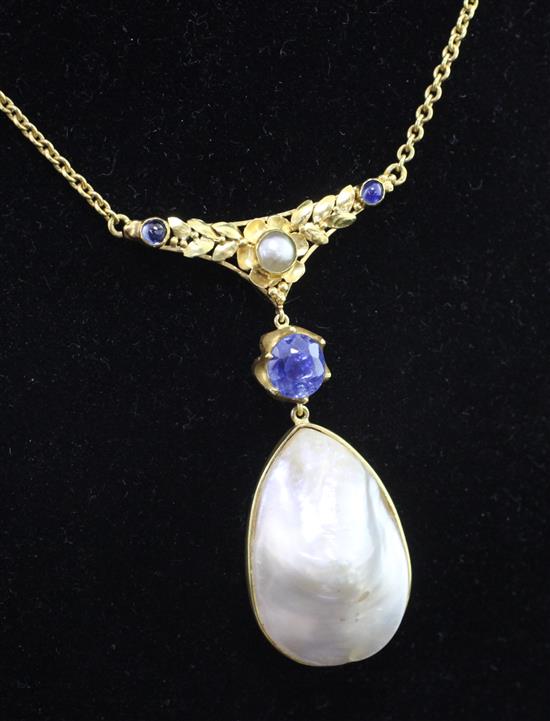 A high carat gold, baroque mabe pearl and sapphire set pendant necklace, pendant 2in.